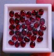 Amazing 14.16ct oval cut cherry red Garnet set