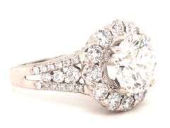 18kt White gold 3.04ct round brilliant cut lab grown diamond in natural diamond halo setting
