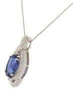 6.57ct Oval Tanzanite and 0.85ctw Diamond Swirl Framed Pendant Necklace in 14K