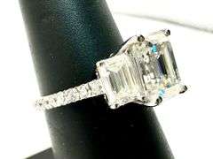 Sparkling 5.5 Ctw 3 Stone Emerald Cut Ice White Fire Moissanite Ring
