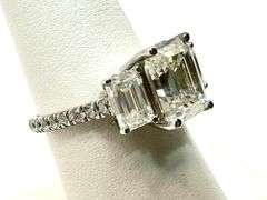 Sparkling 5.5 Ctw 3 Stone Emerald Cut Ice White Fire Moissanite Ring