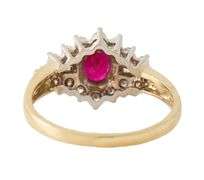 0.60ct Oval Ruby and 0.35ctw Baguette Round Diamond Starburst Frame Ring in 14K