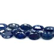 Beautifully colored 7.40ct ink blue Sapphire set