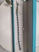 A true statement of elegance of Tanzanite and diamond Bracelet in Silver – GGA Certified. Set in lus