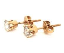 One pair of 14kt yellow gold round brilliant cut diamond stud earrings