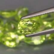 Dazzling 8.60ct untreated apple green Peridot set