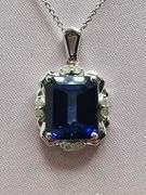 Extremely fine quality Lab grown Sapphire 7.33 CTW and diamond pendent in silver, GGA certfied