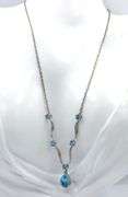 10kt White gold round and pear shaped blue topaz station V necklace