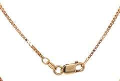 14kt Yellow gold ruby cross pendant on chain