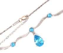 10kt White gold round and pear shaped blue topaz station V necklace