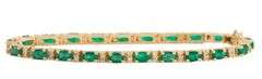 5.50ctw Oval Emerald and 0.65ctw Diamond Accent Tennis Bracelet in 14K