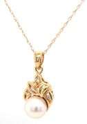 14kt Yellow gold 6.5mm pearl and diamond pendant on chain