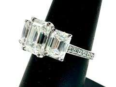 14 Kt White Gold Plate 5.25 Ctw 3 Stone Emerald Cut Ice White Fire Moissanite Ring