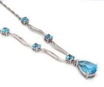 10kt White gold round and pear shaped blue topaz station V necklace