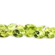 Dazzling 9.10ct untreated apple green Peridot set