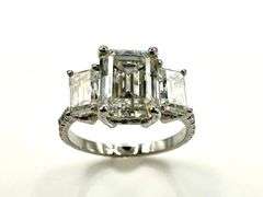 Sparkling 5.5 Ctw 3 Stone Emerald Cut Ice White Fire Moissanite Ring