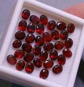 Amazing 14.16ct oval cut cherry red Garnet set