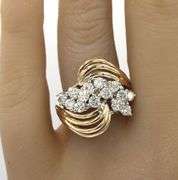 14kt Yellow gold 1.15ctw diamond cluster ring with a bypass shank