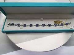 A true statement of elegance of Oval Cabochon Tanzanite Bracelet in Silver – GGA Certified. Set in l