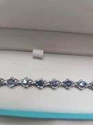 A true statement of elegance of Tanzanite and diamond Bracelet in Silver – GGA Certified. Set in lus