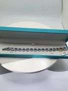 A true statement of elegance of Tanzanite and diamond Bracelet in Silver – GGA Certified. Set in lus