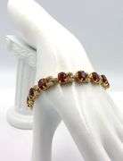 Fabulous 21.30CTW Oval Faceted Ruby & Diamond Bracelet in 14KYellow Gold Over Sterling Silver