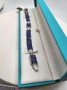 A true statement of elegance of Tanzanite and diamond Bracelet in Silver – GGA Certified. Set in lus