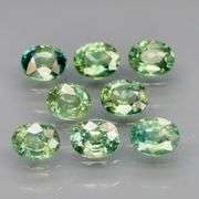 Heated only! Fantastic 2.60ct bright green Sapphire set!