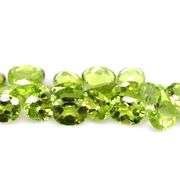 Dazzling 9.20ct untreated apple green Peridot set