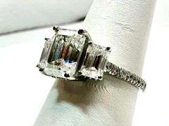 Sparkling 5.5 Ctw 3 Stone Emerald Cut Ice White Fire Moissanite Ring