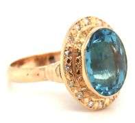 14kt Yellow gold bezel set oval blue topaz and diamond ring
