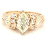 14kt Yellow gold 1ctw marquise and 0.60ctw PS and round side engagement ring