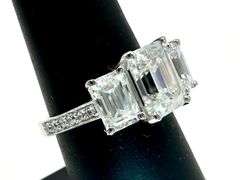 14 Kt White Gold Plate 5.25 Ctw 3 Stone Emerald Cut Ice White Fire Moissanite Ring
