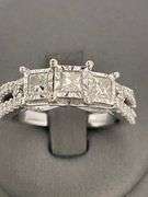 CERTIFIED LADIES 10K WHITE GOLD AND DIAMOND RING.