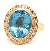 14kt Yellow gold bezel set oval blue topaz and diamond ring