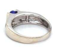 14kt White gold oval Tanzanite and 2 row channel set diamond ring