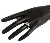 0.60ct Oval Ruby and 0.35ctw Baguette Round Diamond Starburst Frame Ring in 14K