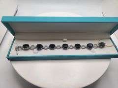 Very fine Black diamond 45.22 ctw with diamond accent set in silver ring, GGV certified