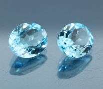 Huge! 12x10mm pair of swiss blue Topaz weighing 9.10 carats!