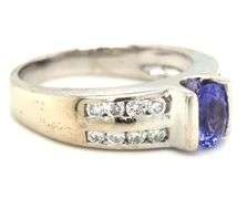 14kt White gold oval Tanzanite and 2 row channel set diamond ring