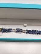 A true statement of elegance of Tanzanite and diamond Bracelet in Silver – GGA Certified. Set in lus