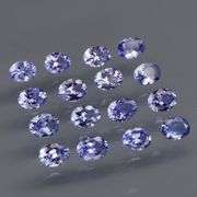 Heavy flashing 2.90ct oval cut Tanzanite set