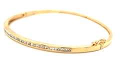 10kt Yellow gold 0.55ctw round brilliant cut and baguette bangle bracelet