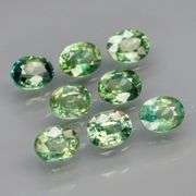 Heated only! Fantastic 2.60ct bright green Sapphire set!
