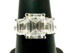 Sparkling 5.5 Ctw 3 Stone Emerald Cut Ice White Fire Moissanite Ring