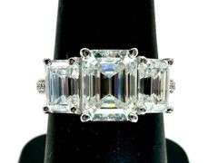 14 Kt White Gold Plate 5.25 Ctw 3 Stone Emerald Cut Ice White Fire Moissanite Ring