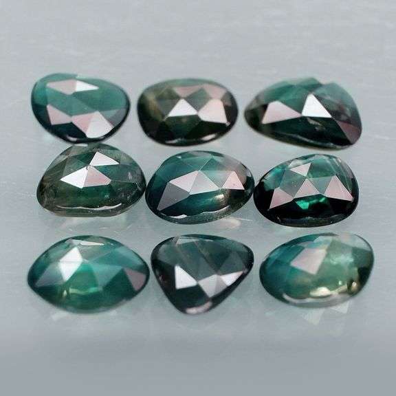 Awesome 4.60ct blue green rose cut Sapphire set!