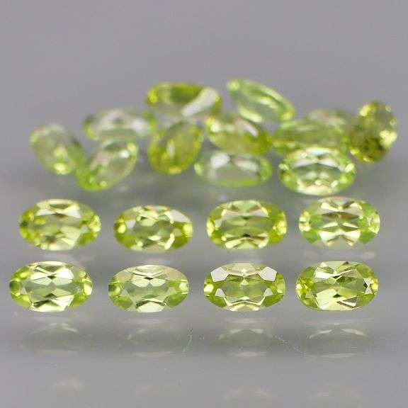 High grade 5.24ct untreated apple green Peridot set