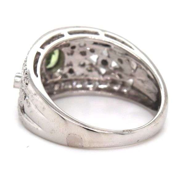 14kt White gold bezel set oval peridot and diamond flower Inspired milgrain ring