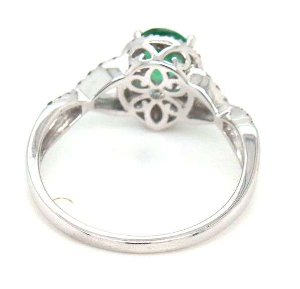 14kt White gold 0.65ct pear shaped emerald and 0.25ctw diamond infinity ring